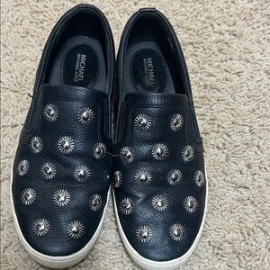 Michael Kors slide on shoes with silver embellishments